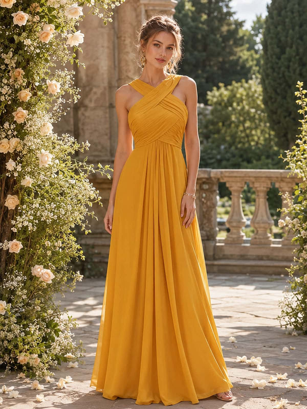 Butterscotch chiffon A-line crisscross halter floor-length bridesmaid dress front view with ruched bodice and flowing skirt