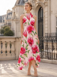 Floral chiffon high-low bridesmaid dress with halter neckline, sleeveless bodice, flowing A-line skirt, and asymmetric hem