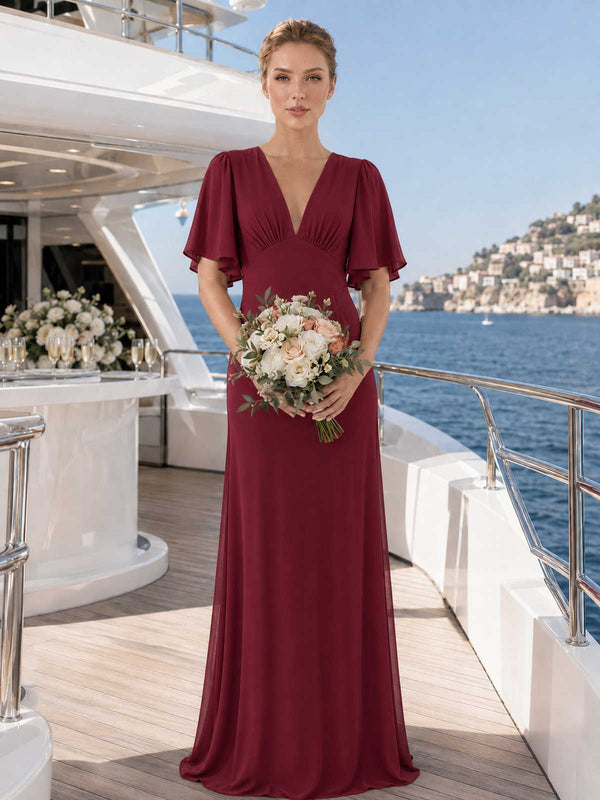 Burgundy chiffon bridesmaid dress with V-neckline, flutter sleeves, defined waist, and flowing floor-length A-line skirt