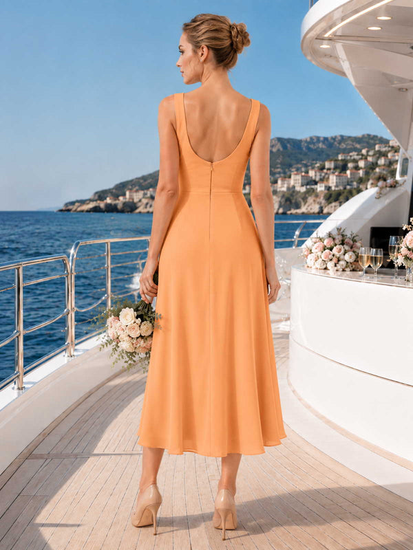 Orange chiffon bridesmaid dress with scoop back, wide straps, center back zipper, and flowing midi A-line skirt