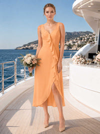 Orange chiffon bridesmaid dress with V-neckline, wide straps, cascading ruffle detail, front slit, and midi A-line skirt