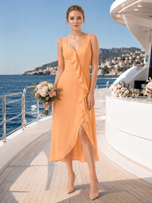 Orange chiffon bridesmaid dress with V-neckline, wide straps, cascading ruffle detail, front slit, and midi A-line skirt