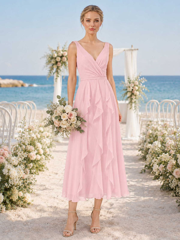 Blush chiffon bridesmaid dress with V-neckline, wide straps, ruched bodice, cascading ruffle detail, and midi A-line skirt