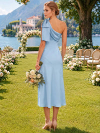 Light blue faux silk bridesmaid dress with asymmetric back neckline, shoulder bow, center back zipper, and sleek midi sheath silhouette