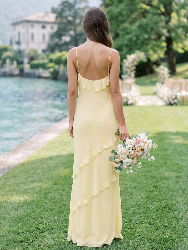 Daffodil chiffon bridesmaid dress with open back, spaghetti straps, cascading ruffle detail, and flowing floor-length sheath silhouette