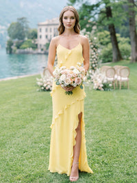 Daffodil chiffon bridesmaid dress with spaghetti straps, V-neckline, cascading ruffle detail, front slit, and floor-length skirt
