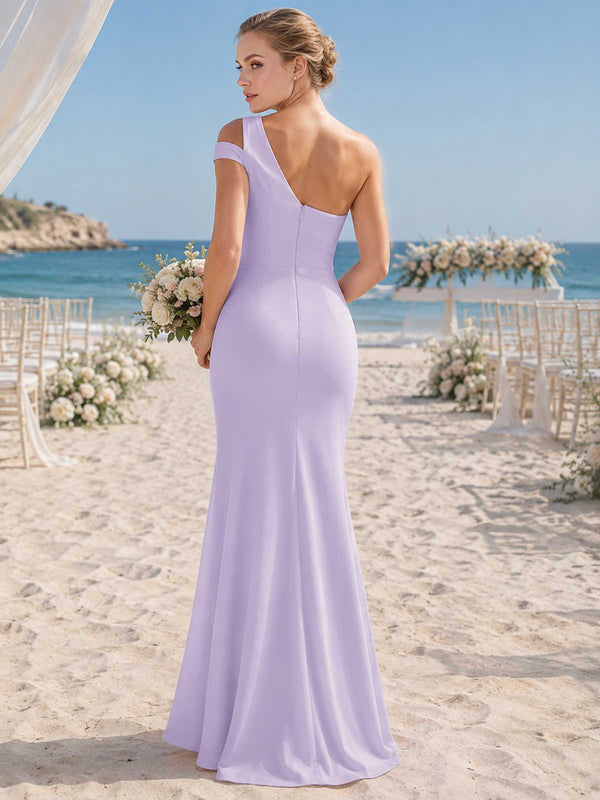 Lavender chiffon bridesmaid dress with asymmetric open back, one-shoulder strap detail, fitted waist, and flowing floor-length hem
