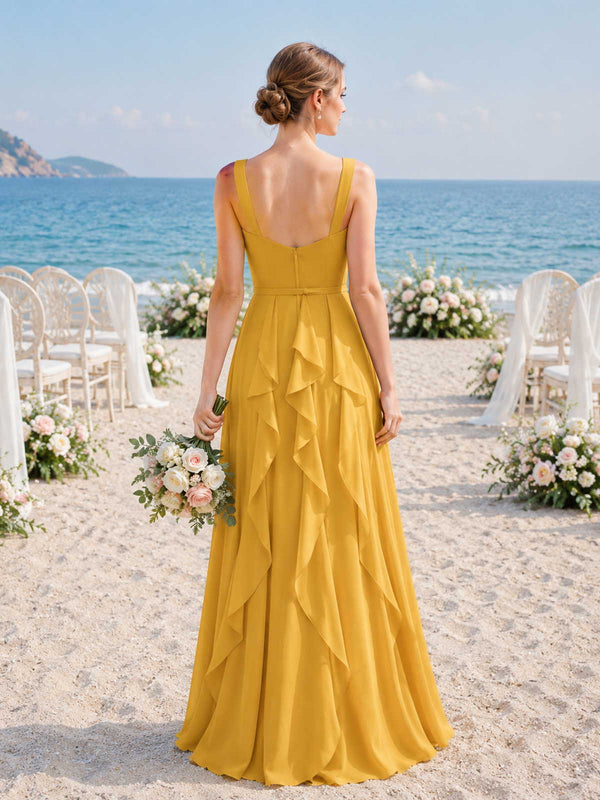 Back view of a marigold chiffon floor-length bridesmaid dress with wide straps, open back, center back zipper, fitted waist, cascading back ruffles, and flowing A-line skirt.