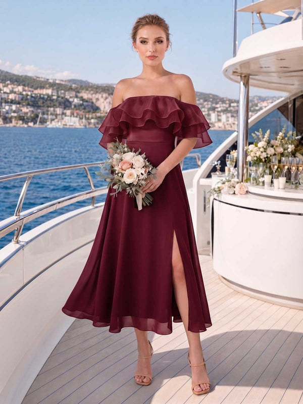 Front view of a burgundy chiffon midi bridesmaid dress with off-shoulder neckline, layered organza ruffle bodice, fitted waist, front slit, and flowing A-line skirt.