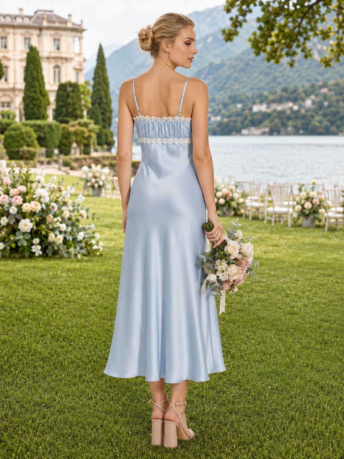 Back view of a light blue satin ankle-length bridesmaid dress with spaghetti straps, straight back neckline, white lace trim, softly gathered upper bodice, fitted silhouette, and fluid sheath skirt.
