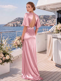 Back view of a desert rose satin floor-length bridesmaid dress with flutter sleeves, dramatic open keyhole back, back zipper, fitted waist, and sleek flowing sheath silhouette.