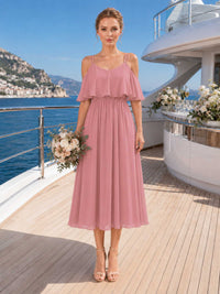 Front view of a desert rose chiffon tea-length bridesmaid dress with scoop neckline, double spaghetti straps, flutter overlay bodice, cold-shoulder detail, defined waist, and flowing A-line skirt.