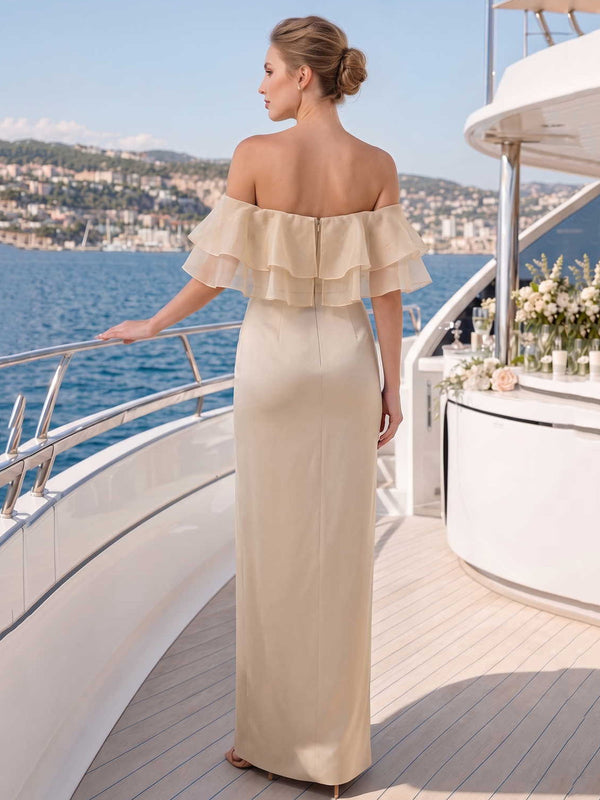 Back view of a champagne satin floor-length bridesmaid dress with off-shoulder layered organza ruffles, center-back zipper, fitted waist, and smooth flowing A-line skirt.