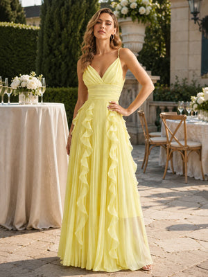 Front view of a yellow chiffon floor-length bridesmaid dress featuring delicate spaghetti straps, a V-neck gathered crossover bodice, wide ruched waistband, finely pleated A-line skirt, and cascading chiffon ruffles extending vertically down the front and sides.