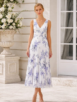 Front view of a floral chiffon tea-length bridesmaid dress featuring a clean V-neckline, wide sleeveless shoulder straps, fitted waist, blue and lavender botanical floral print, and finely pleated A-line skirt.