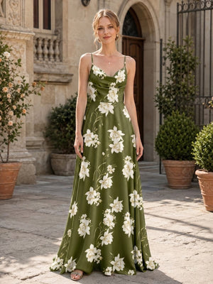 Front view of a floral imitation silk floor-length bridesmaid dress featuring a softly draped cowl neckline, delicate spaghetti straps, fitted waist, olive green base with large ivory floral motifs, and a flowing A-line skirt.