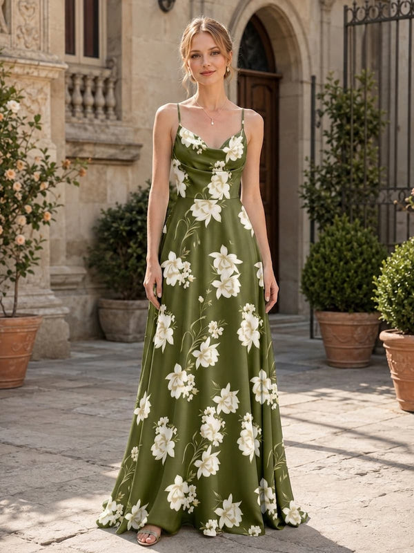 Front view of a floral imitation silk floor-length bridesmaid dress featuring a softly draped cowl neckline, delicate spaghetti straps, fitted waist, olive green base with large ivory floral motifs, and a flowing A-line skirt.