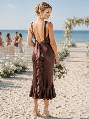 Back view of a brown imitation silk bridesmaid dress featuring a dramatic deep V-back, wide shoulder straps, fitted mermaid silhouette, cascading vertical back ruffle detail, and softly flared midi hem.