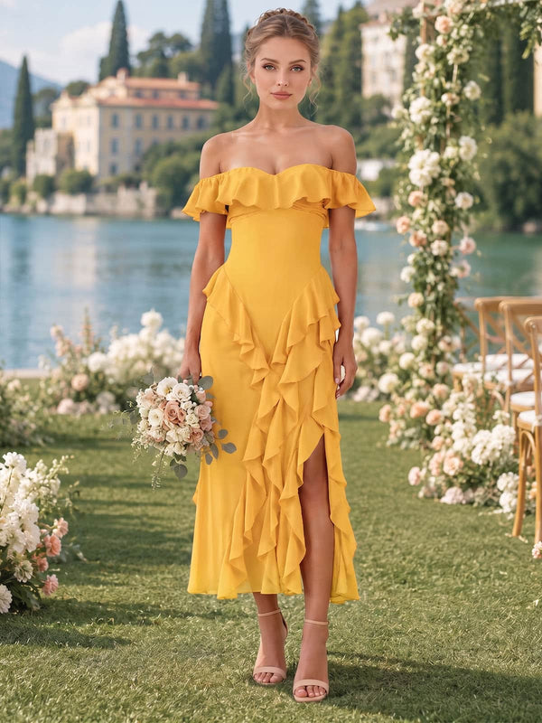 Front view of a marigold chiffon bridesmaid dress featuring an off-the-shoulder ruffled neckline, fitted bodice, flowing A-line silhouette, cascading layered ruffles, front slit, and ankle-length hem.