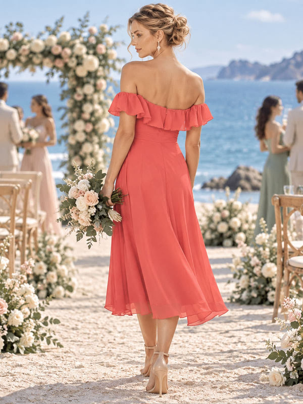 Back view of a coral chiffon bridesmaid dress featuring an off-the-shoulder back neckline with ruffle trim, fitted waist, concealed center-back zipper, flowing A-line skirt, and tea-length chiffon hem.