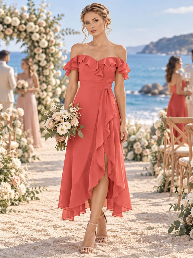 Front view of a coral chiffon bridesmaid dress featuring an off-the-shoulder sweetheart neckline, layered ruffle trim, short flutter sleeves, defined waist, cascading front ruffles, A-line silhouette, and tea-length high-low hem.