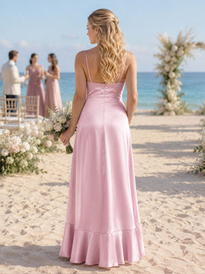 Back view of a light pink imitation silk bridesmaid dress featuring slim spaghetti straps, a clean straight-back bodice, concealed center-back zipper, defined waist, flowing A-line skirt, and softly flared ruffle hem.