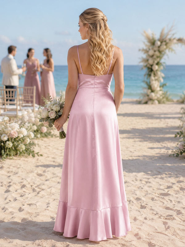 Back view of a light pink imitation silk bridesmaid dress featuring slim spaghetti straps, a clean straight-back bodice, concealed center-back zipper, defined waist, flowing A-line skirt, and softly flared ruffle hem.