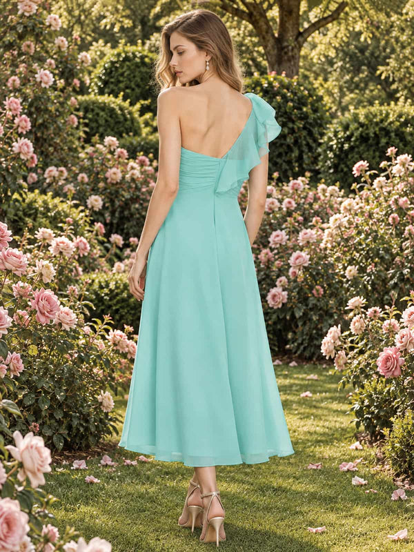 Mint chiffon one-shoulder tea-length bridesmaid dress with asymmetric shoulder ruffle and concealed back zipper, back view.