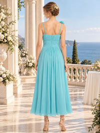 Aqua chiffon midi bridesmaid dress with spaghetti straps, ruched waist and concealed back zipper, back view.
