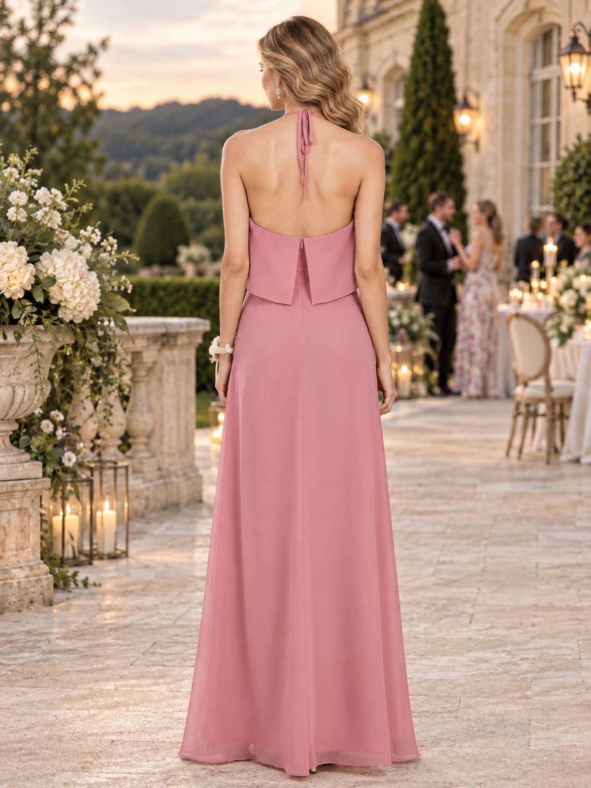 Dusty rose chiffon halter bridesmaid dress with open back, neck tie and flowing floor-length A-line skirt, back view.
