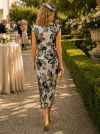 Floral jacquard column midi evening dress back view with structured shoulders, peplum waist, back slit, and concealed zipper