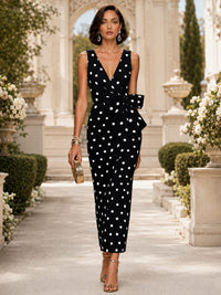 Polka dot fabric sleeveless V neck midi evening dress with side bow detail front view