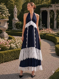 Satin A-line halter-neck tea-length evening dress front view with lace trim insets, open back tie, and tiered skirt
