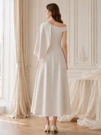 Satin one shoulder midi length evening dress back view with cape overlay detail