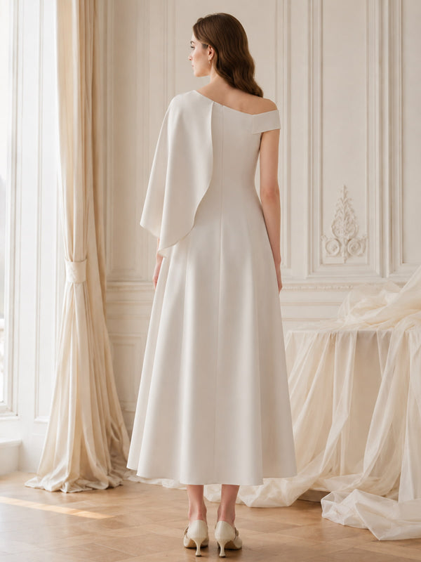 Satin one shoulder midi length evening dress back view with cape overlay detail