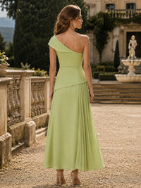 Chiffon one shoulder midi length evening dress back view with asymmetric neckline and flowing pleated skirt