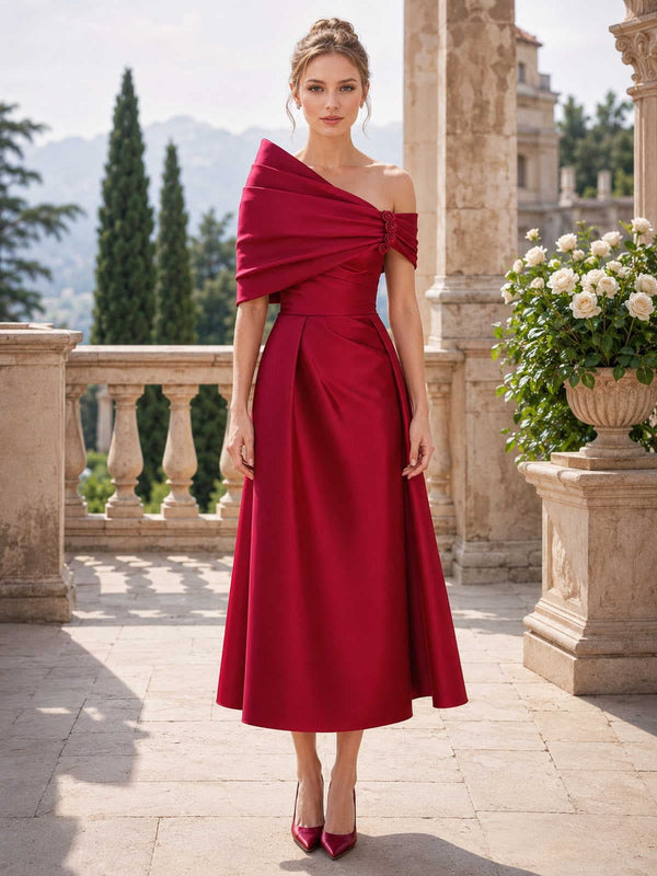 Satin off shoulder midi length mother of the bride evening dress front view with draped shoulder bow detail