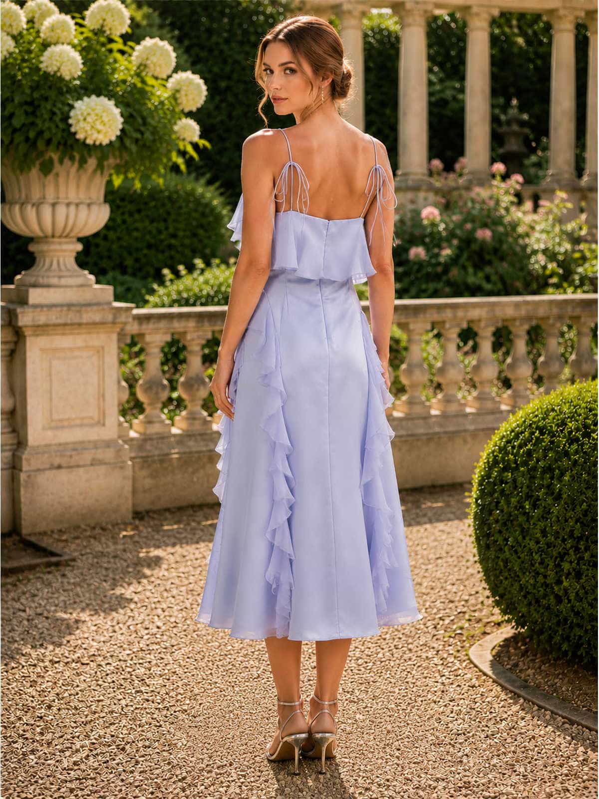 Faux silk midi length evening dress back view with fitted bodice and layered ruffle details