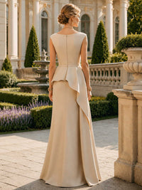 Satin floor length evening dress back view with sleeveless bateau neckline and asymmetric peplum detail