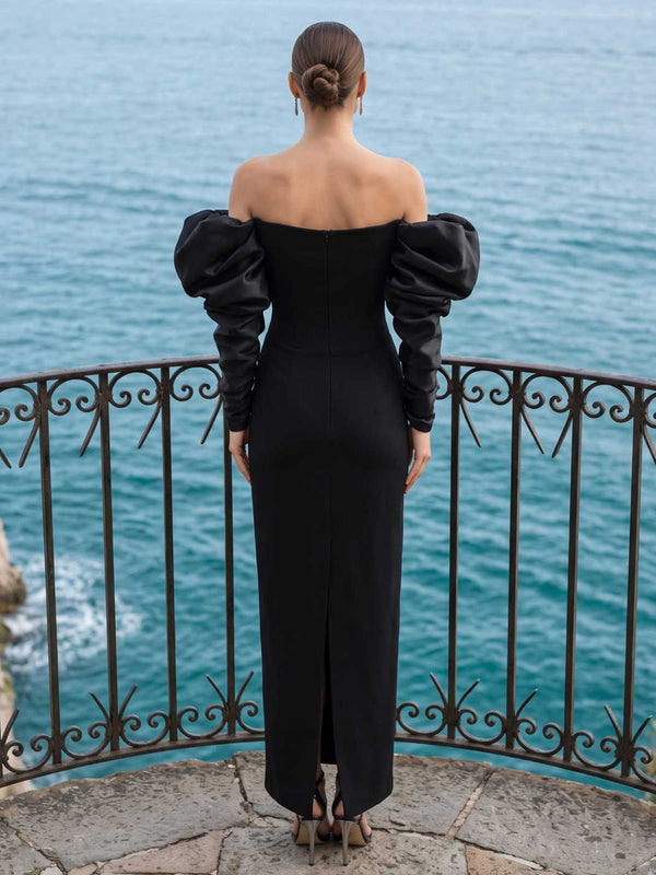 Black satin fitted evening dress back view with off shoulder neckline, puff long sleeves, back slit, and concealed zipper