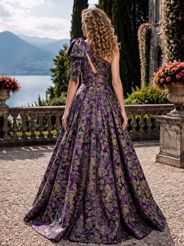 As pic color floral jacquard satin mother of the bride dress back view with one shoulder bow detail, full skirt, and concealed zipper