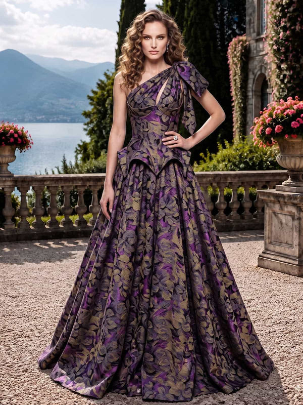 As pic color floral jacquard satin mother of the bride dress front view with one shoulder neckline, bow detail, and floor length A-line skirt