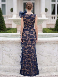 Floral lace mother of the bride dress back view with illusion back, organza shoulder ruffle, floor length mermaid silhouette, and concealed zipper