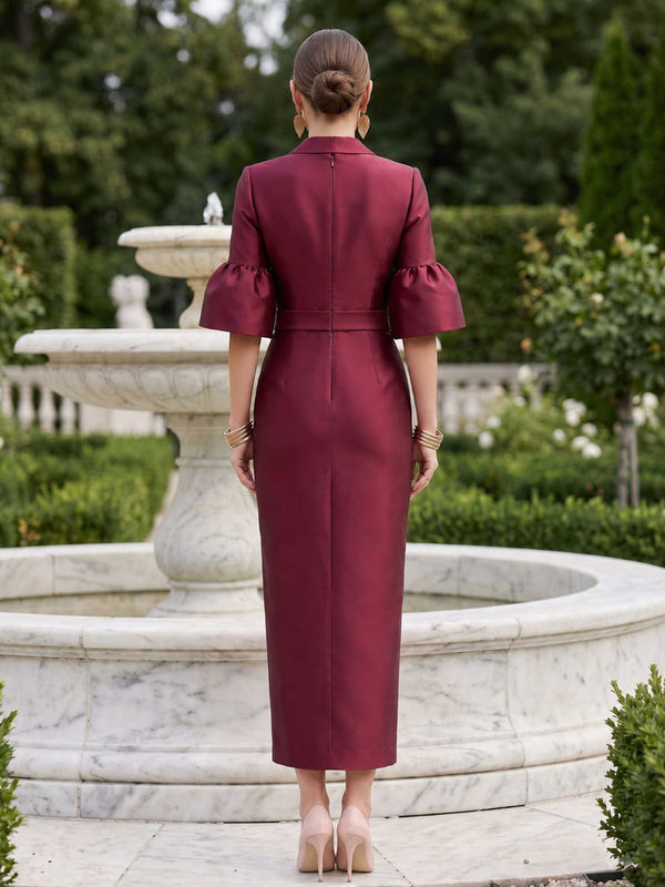 Satin mother of the bride dress back view with blazer collar, puff short sleeves, concealed back zipper, waist belt detail, and midi pencil skirt