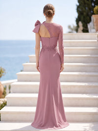 Dusty rose satin mother of the bride dress back view with asymmetrical lace shoulder, one long lace sleeve, bow detail, concealed back zipper, and floor length skirt