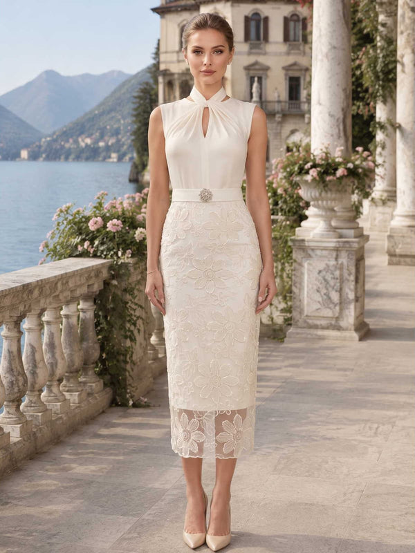 Satin lace mother of the bride dress front view with halter neckline, keyhole detail, embellished waist belt, floral lace applique, and tea length sheath skirt