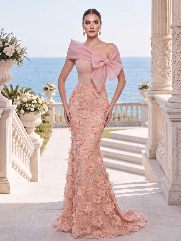 Tulle mother of the bride dress front view with off-shoulder neckline, sheer draped wrap, bow detail, 3D floral applique, fitted bodice, and floor length mermaid skirt