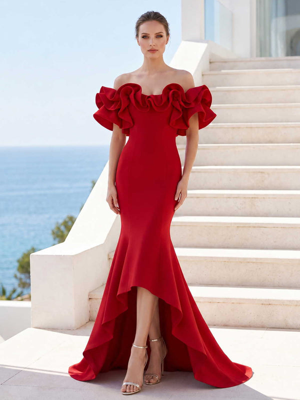 Satin mother of the bride dress front view with off-shoulder neckline, sculptural layered ruffle accents, fitted bodice, mermaid silhouette, and high low hem