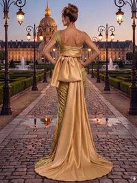 Jacquard satin mother of the bride dress back view with asymmetrical one-shoulder back, oversized bow detail, long satin train, concealed back zipper, and floor length fitted skirt