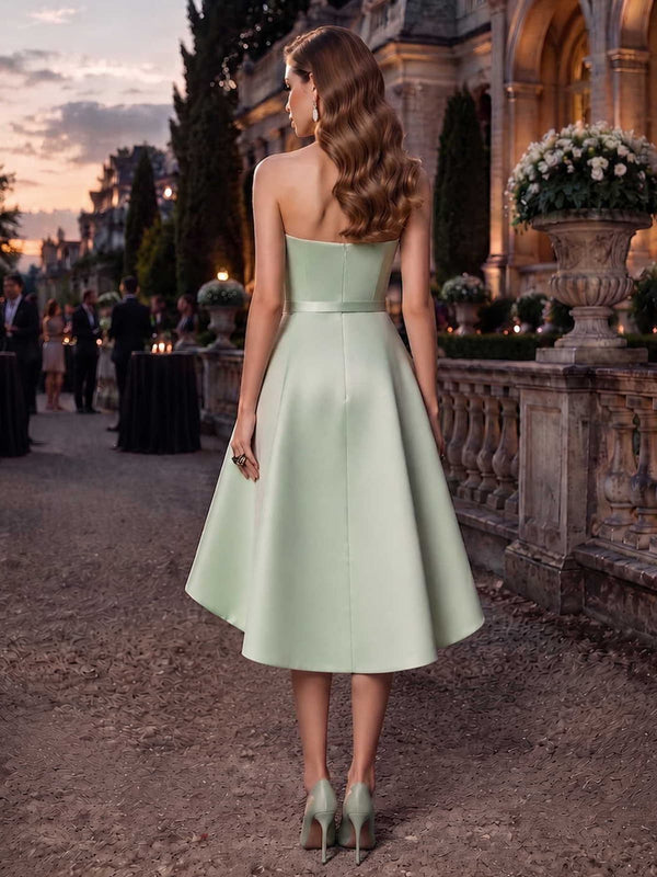 Sage green satin mother of the bride dress back view with strapless bodice, concealed back zipper, defined waist, and tea length flared skirt